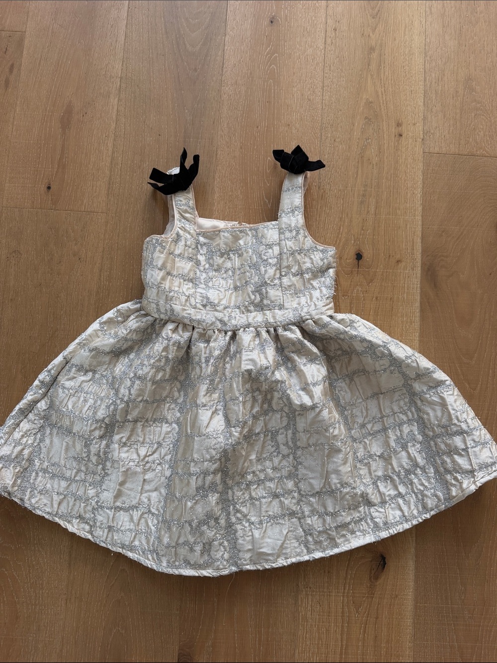 Ivory Metallic Pattern Girls Party Dress with Black Bow Straps